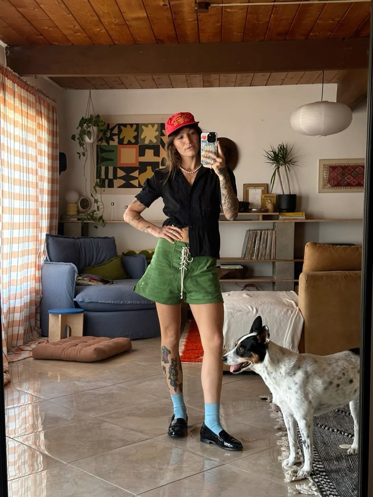 Green corduroy shorts with black shirt
